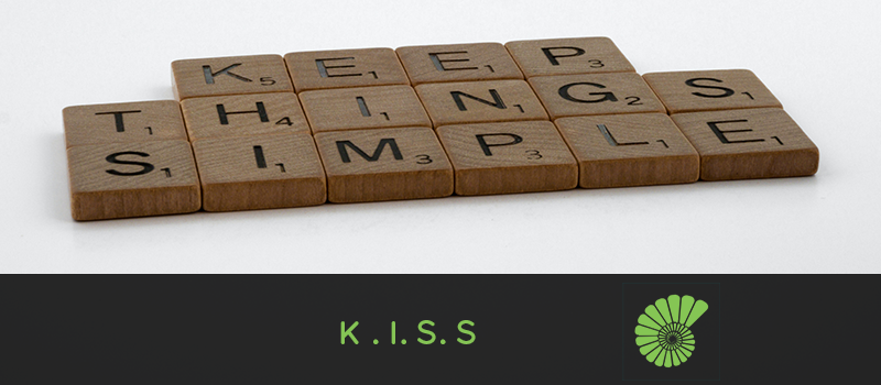 scrabble letters say keep things simple text reads K . I. S. S with the Ammonite logo on the right hand side of the text